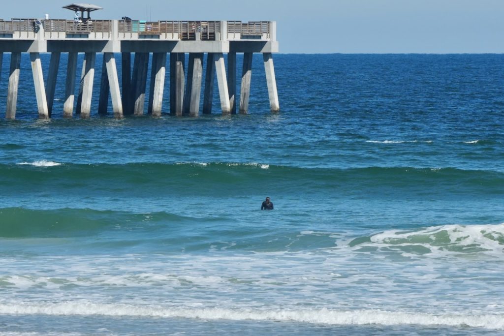 Images of surfers riding waves