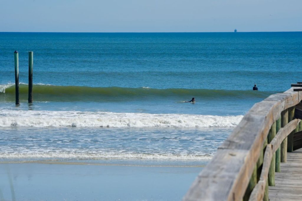 A photo gallery of surfers riding waves.